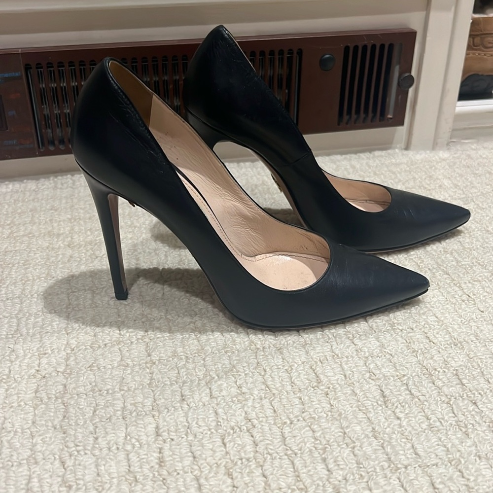 Black Classic Prada pumps 38.5. Wear on bottom/inside but amazing on outside